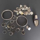 A selection of silver and white metal jewellery, to include a charm bracelet suspending twenty-one