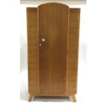 An Art Deco wardrobe, single door with shelf and hanging interior, on splayed supports 176cm high,