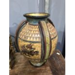 An Italian sgraffito decorated vase in the ancient Roman style, four strap handles between