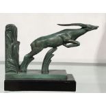 Max Le Verrier, an Art Deco patinated art metal figural bookend, modelled as a leaping gazelle, 17cm