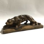 An Art Deco plaster figure of a stalking panther together with a brass figure after Lalique