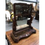 A Victorian mahogany serpentine fronted toilet mirror, 62cm wide, 25cm deep