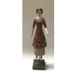 Foreside folkart resin moulded articulated figure of a lady, on wooden block base