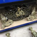 A large cast metal fire grate together with a pair of andirons (3)