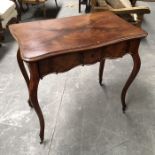 A 19th century French mahogany serpentine side table, fitted single drawer with carved C scroll