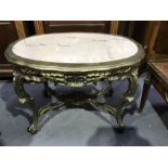 A carved gilt wood marble top side table, ogle moulded border and reticulated frieze, on double C