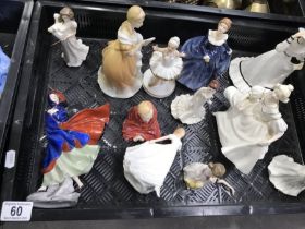 Collection of porcelain ladies, including Royal Do