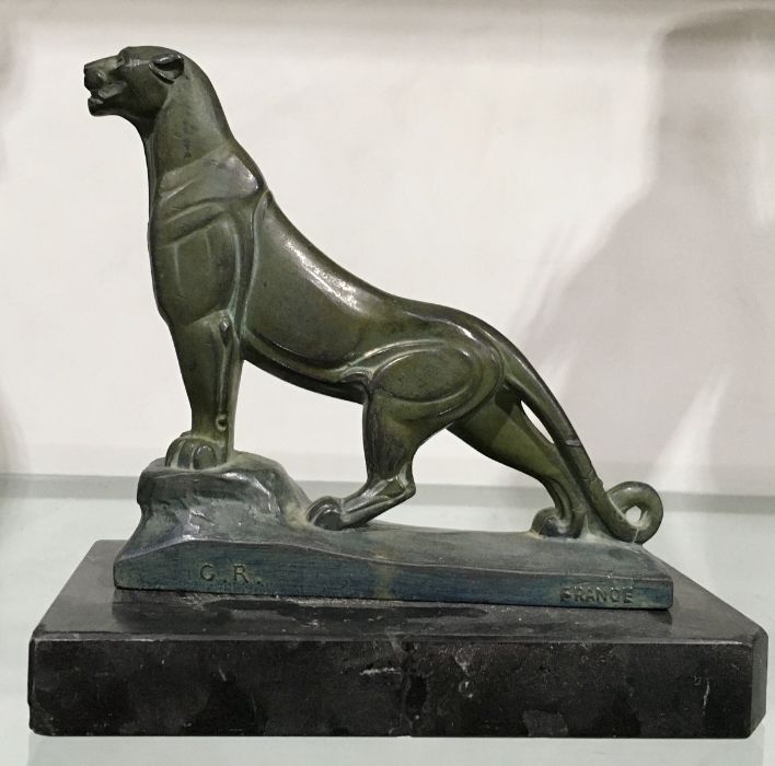 Frecourt, an Art Deco patinated art metal figure, or bookend, modelled as a lion, on marble slab