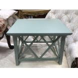A painted side table with trellis and block supports, 54cm wide