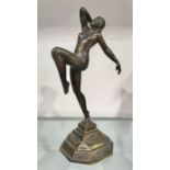 An Art Deco style bronze figure of a dancer, modelled with one leg bent, 27cm high