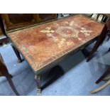 A marquetry inlaid and crossbanded coffee table, reticulated brass gallery, on caryatid brass
