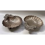 A pair of Italian Olri plated shell form entree dishes, on three dolphin supports, 33.5cm wide (2)