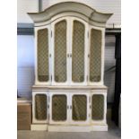 A French style arch form mesh panelled painted bookcase, converted to tv cabinet, two bifold doors