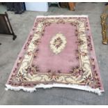 Persian style wool carpet, peach ground with floral ivory medallions, 280cm x 182cm wide