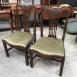 A pair of 19th century Chippendale style dining chairs, drop in upholstered seats on square supports