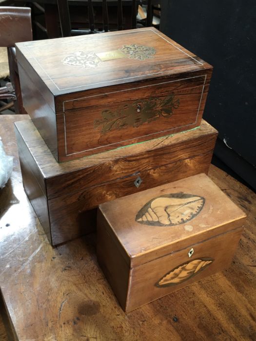 A George III rosewood tea caddy, together with a rosewood and brass feet inlaid box, lacking