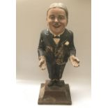 An early 20th century papier mache advertising figure 'Mr Jaunty says Hair Cut Sir', 72cm high