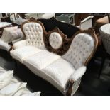 A Victorian walnut framed to three seat medallion sofa, button back, on carved cabriole supports,