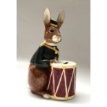 A Royal Doulton Bunnybank, D6615, modelled as a uniformed rabbit with drum, 22.5cm high