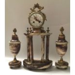A French marble eight day striking portico mantel clock, brass cased drum movement surmounted with