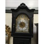 An ebonised eight day weight driven long case clock, with brass and silvered dial