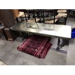 A sheet metal topped low table, cast scroll end supports, 51cm high, 174cm wide, 54cm deep