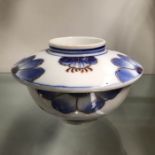 An Oriental blue and white tea cup and lid, gilt f