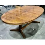 In the style of Martin Hall for Gordon Russell, a mid century extending dining table, oval form,