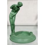 Raymonde Guerbe, an Art Deco patinated art metal figural ashtray, modelled as a nude woman peering
