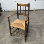 A 19th century Sussex style rush seated spindle back armchair