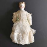 An 19th century china shoulder head doll, pierced ears, composite jointed body, in white linen