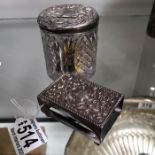 A silver topped glass jar containing cufflinks, together with a silver matchbox case