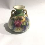 A Hadley's Royal Worcester twin handled vase, date cypher for 1908, painted with roses, No.H.178,