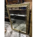 A gilt framed bevelled glass wall mirror, 103cm x 74cm