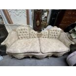 A French sofa/canapé, gesso style moulded floral and foliage frame with brocade style upholstery, on