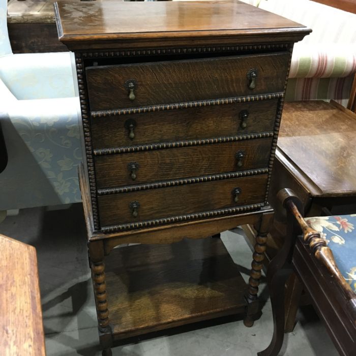 An oak sheet music cabinet, early 20th Century of old English design, four graduated drawers with