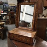 An early 19th Century Dutch style mahogany and boxwood marquetry inlaid toilet mirror, fitted single