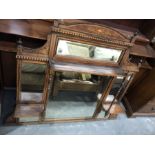 An Edwardian mahogany and marquetry inlaid overmantel mirror fitted two shelves, and bevelled