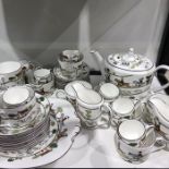 A Wedgwood Hunting Scenes tea service, including teapot, cups, saucers, jugs etc