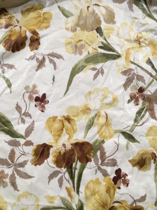 A pair of chintz glazed cotton professionally made curtains, printed in autumnal hues with gulag