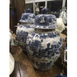 A large pair of Chinese style jars and covers, painted will pattern decoration, 60cm high (2)