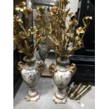 A pair of French Louis XVI style marble and gilt metal mounted urns, baluster footed form with