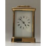 A late 19th century French gilt brass carriage clock with repeat, 12.5cm high