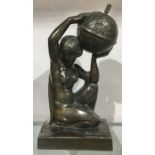 An Art Deco patinated art metal figural table lighter, modelled as a kneeling nude woman holding a