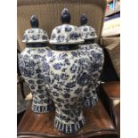 Three blue and white altar table vases and covers in the Chinese style, lobed inverse baluster form,