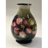 A Moorcroft pansy vase, 16cm high