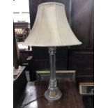 A glass table lamp base, lobed reeded form, on facet sickle foot and circular metal base