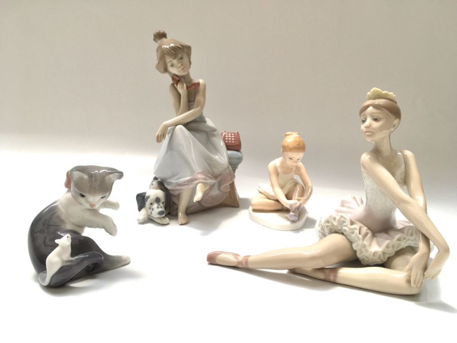 A collection of Lladro figures, including 'Chit Chat', ballerina with tiara, cat and mouse, and a