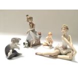 A collection of Lladro figures, including 'Chit Chat', ballerina with tiara, cat and mouse, and a