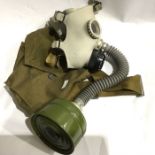 Two gas masks and bags, one stamped Avon 1986 (2)
